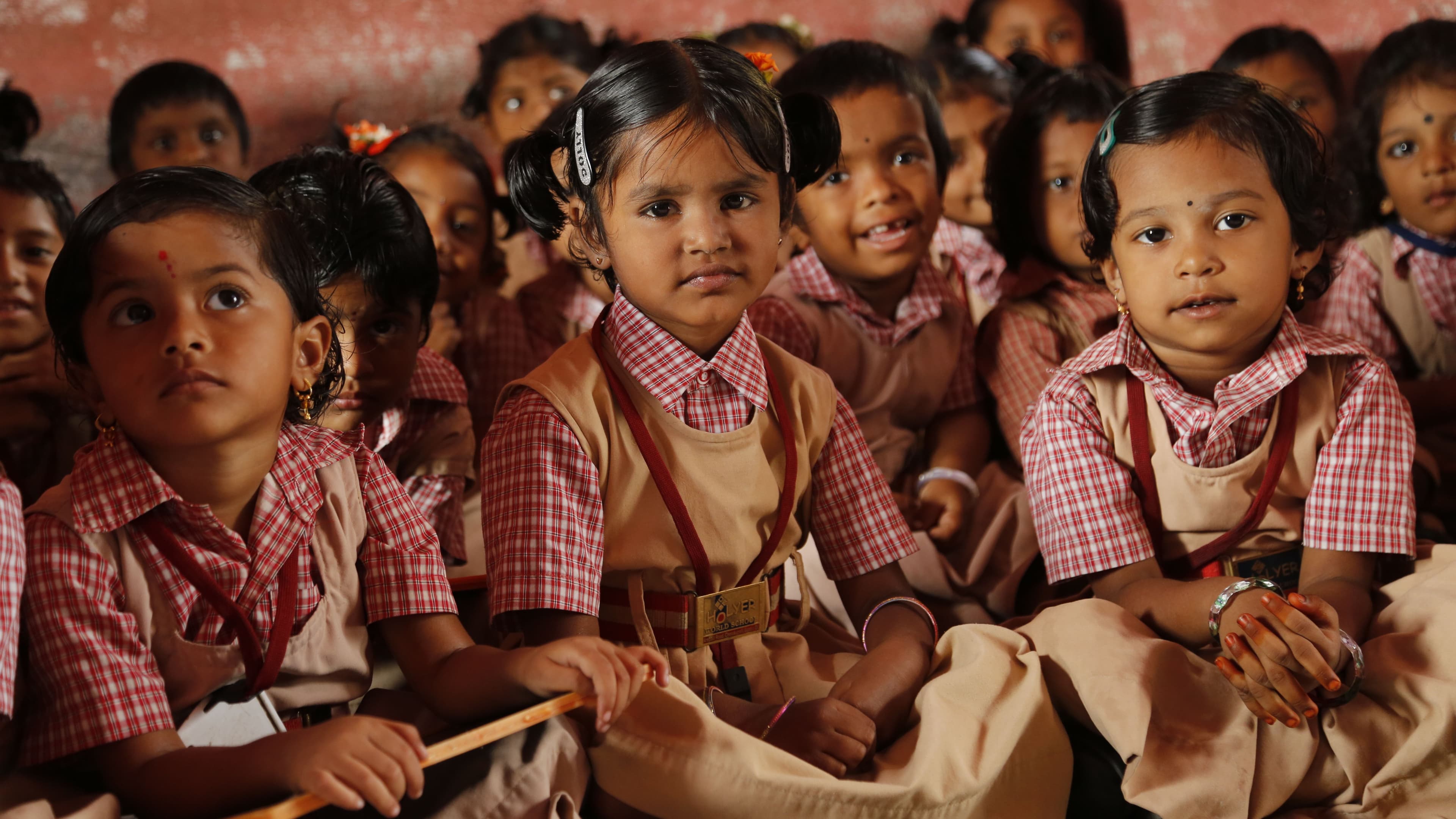 Schoolchildren in uniform in a rural Odisha classroom